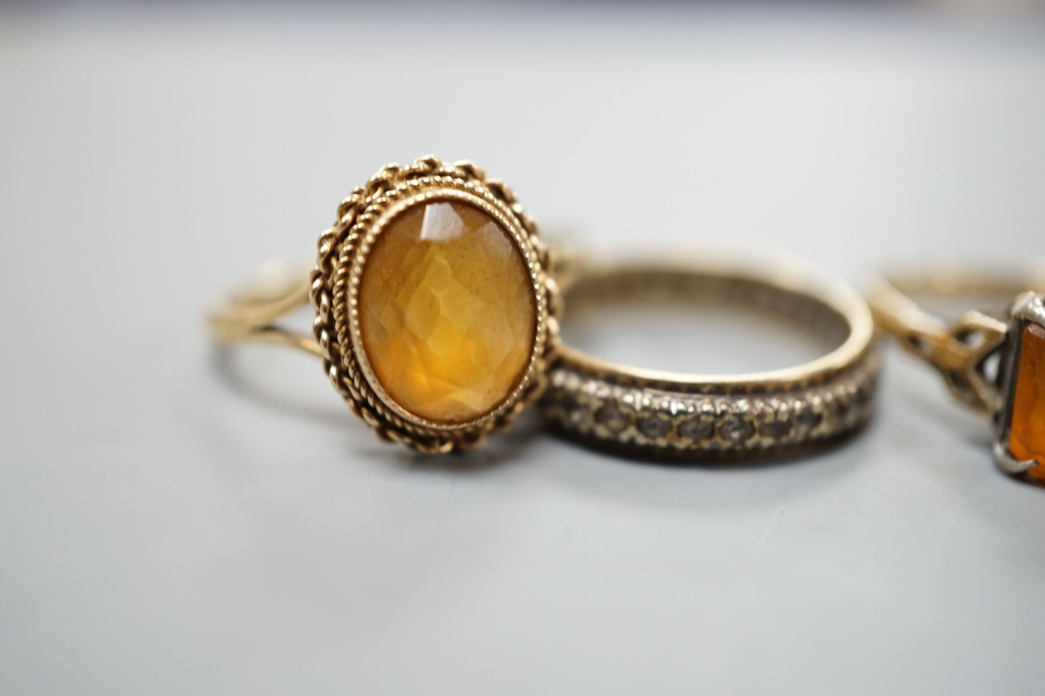 Five assorted 9ct gold and gem set dress rings, including citrine and cultured pearl, gross 12.2 grams.